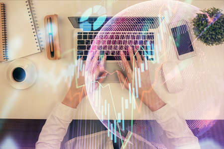 Double exposure of woman hands working on computer and forex chart hologram drawing. Top View....
