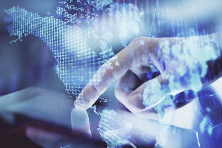 Multi exposure of mans hands holding and using a digital phone and forex graph drawing. Financial...