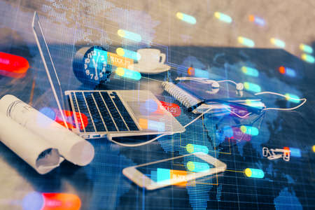 Double exposure of table with computer on background and data theme drawing. Concept of innovation.