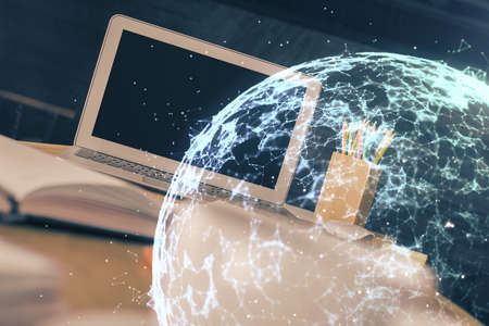 Computer on desktop with social network hologram. Multi exposure. Concept of international people connections.の写真素材
