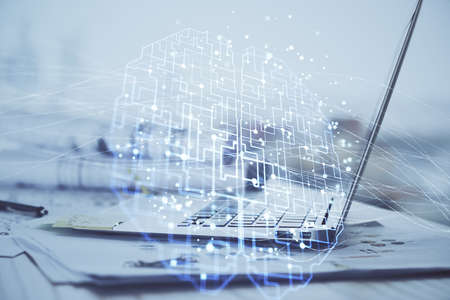 Multi exposure of work table with computer and brain hologram. Brainstorm concept.
