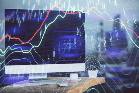 Forex market chart hologram and personal computer background. Multi exposure. Concept of investment.