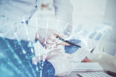 Mans hands working with notes background. Genetic engineering and gene manipulation concept. Multi...