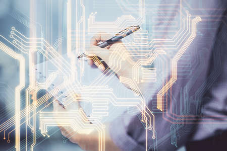 Technology theme hologram over womans hands taking notes background. Concept of Tech. Double exposureの写真素材
