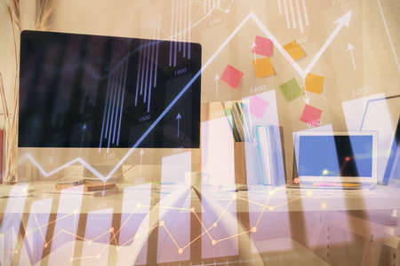 Double exposure of financial graph drawing and office interior background. Concept of stock market.の写真素材