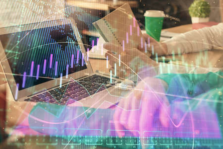 Double exposure of man and woman working together and forex chart hologram. Business concept....
