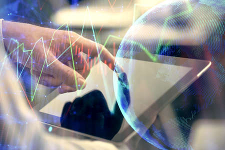 Multi exposure of mans hands holding and using a phone and financial chart drawing. Market analysis concept.の写真素材