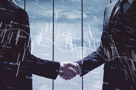 Double exposure of forex graph hologram and handshake of two men. Stock market concept.
