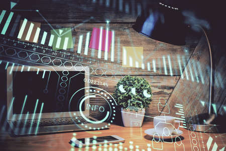 Computer on desktop in office with technology theme hologram. Double exposure. Tech concept.の写真素材