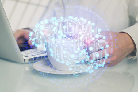 Man with computer background with brain theme hologram. Concept of brainstorm. Double exposure.