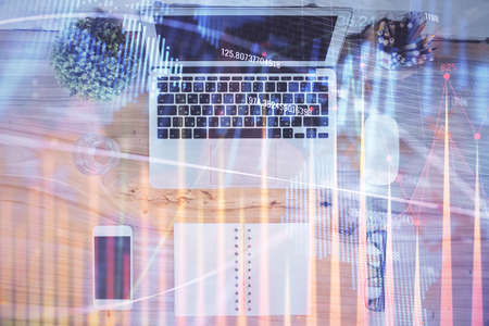 Multi exposure of financial chart drawing over table background with computer. Concept of research....