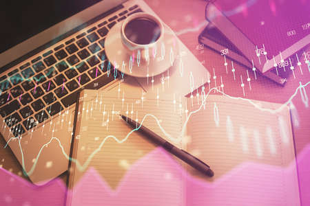 Stock market graph and top view computer on the table background. Multi exposure. Concept of...
