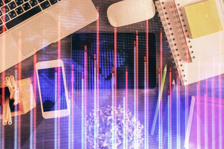 Double exposure of forex chart hologram over desktop with phone. Top view. Mobile trade platform...