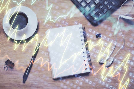Multi exposure of forex chart drawing and work table top veiw. Concept of financial analysis.