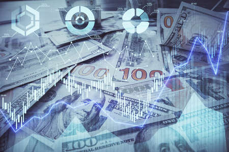 Multi exposure of forex chart drawing over us dollars bill background. Concept of financial success...