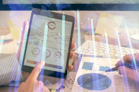 Multi exposure of mans hands holding and using a phone and financial chart drawing. Market analysis concept.の写真素材