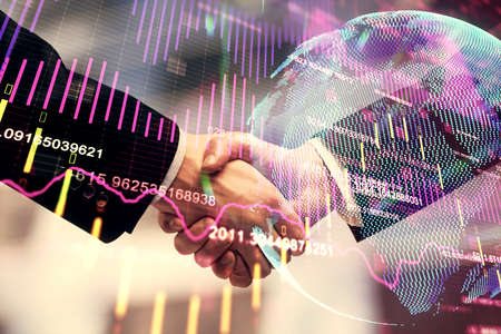 Double exposure of forex graph hologram and handshake of two men. Stock market concept.