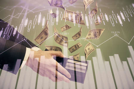 Multi exposure of financial graph drawing hologram and USA dollars bills and man hands. Analysis concept.の写真素材