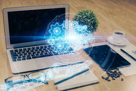 Double exposure of table with computer on background and data theme drawing. Concept of innovation.