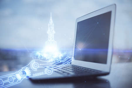 Desktop computer background in office and start up theme hologram drawing. Double exposure. Startup...