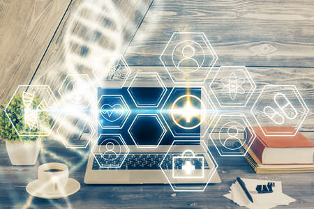 Desktop computer background and DNA drawing. Double exposure. Science concept.