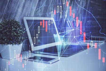 Financial graph colorful drawing and table with computer on background. Double exposure. Concept of...