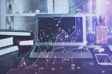 Financial graph colorful drawing and table with computer on background. Double exposure. Concept of...