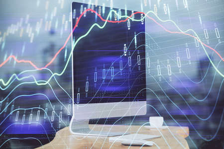 Financial market graph hologram and personal computer on background. Double exposure. Concept of...