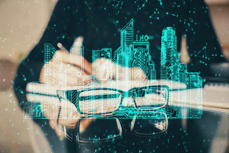 IOT drawing over writing hands in notepad background. Concept of smaert home. Multi exposure
