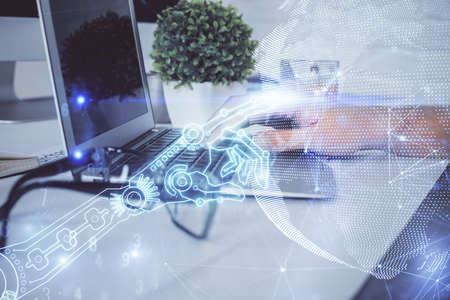 Technology theme hologram with man working on computer on background. High tech concept. Multi...