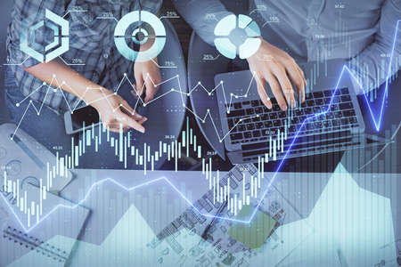 Multi exposure of man and woman working together and forex graph hologram drawing. Financial...