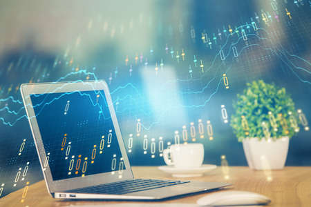 Forex Chart hologram on table with computer background. Double exposure. Concept of financial...
