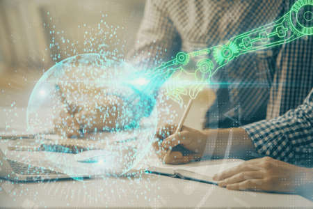 Businessman with computer background with technology theme hologram. Concept of hightech. Multi...