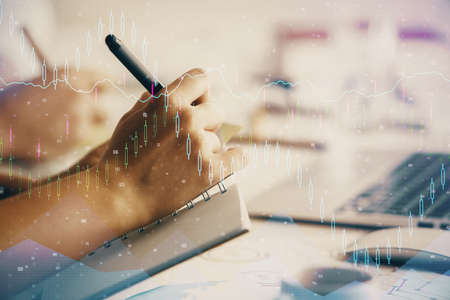 Double exposure of forex chart drawing over people taking notes background. Concept of financial...
