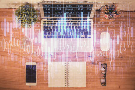 Multi exposure of financial chart drawing over table background with computer. Concept of research....