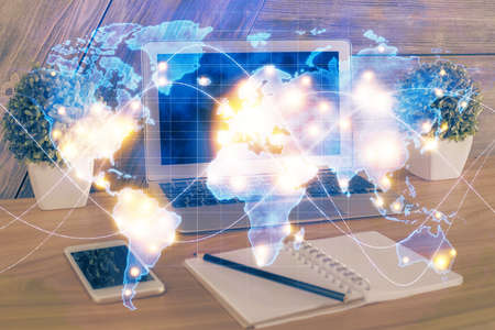 Multi exposure of business theme icons and work space with computer background. Concept of success.