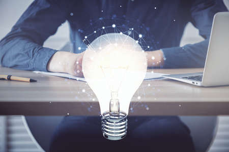 Innovative your business. Idea concept icon on writing mans hand background. Multi exposure.の写真素材