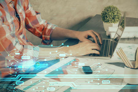 Double exposure of technology hologram with man working on computer background. Concept of big data.