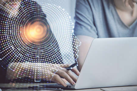 Businessman with computer background with brain theme hologram. Concept of brainstorm. Multi...