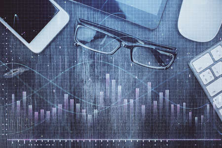 Multi exposure of forex graph hologram over desktop with phone. Top view. Mobile trade platform concept.の写真素材