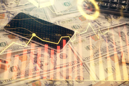 Double exposure of forex graph drawing over us dollars bill background. Concept of financial...