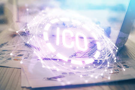 Double exposure of blockchain theme hologram and table with computer background. Concept of bitcoin crypto currency.の写真素材