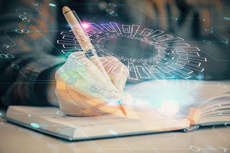 Multi exposure of womans writing hand on background with data technology hologram. Concept of innovation.の写真素材