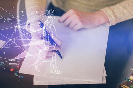 Start up creative drawing over close up hands in notepad background. Concept of brainstorming....