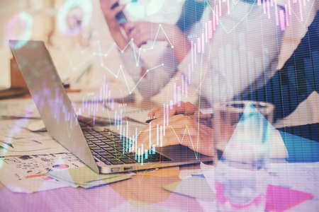 Multi exposure of woman hands typing on computer and forex chart hologram drawing. Stock market...