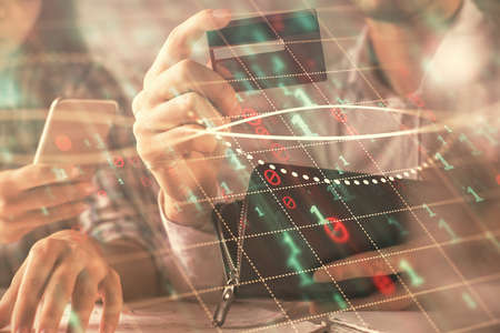 Double exposure of man and woman on-line shopping holding a credit card and forex graph hologram...