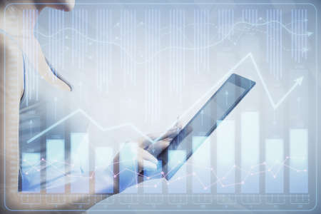 Double exposure of forex chart sketch hologram and woman holding and using a mobile device....