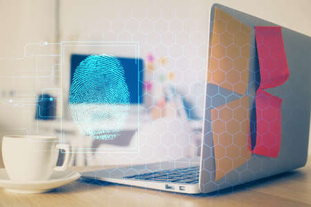Computer on desktop in office with finger print drawing. Double exposure. Concept of business data...