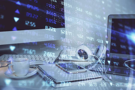 Financial market graph hologram and personal computer on background. Double exposure. Concept of...