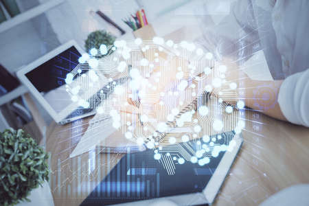 Multi exposure of writing hand on background with brain hologram. Concept of learning.